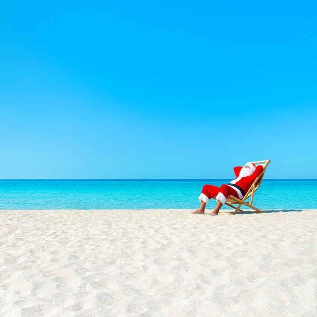 Santa is lying on the beach