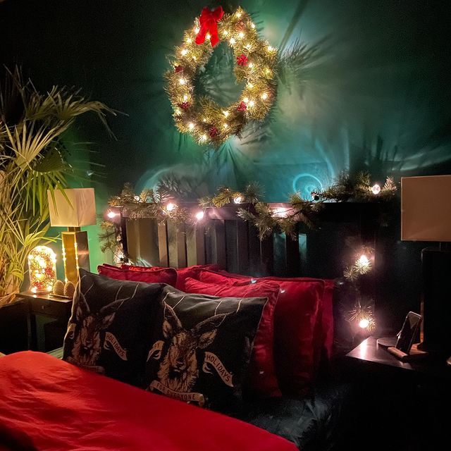 Christmas bed with glowing Christmas wreath