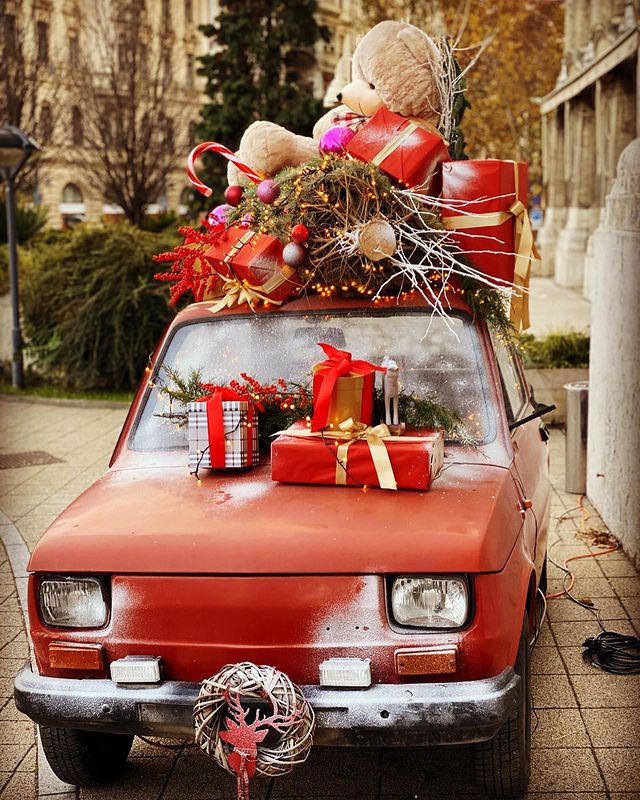 A small car with Christmas presents