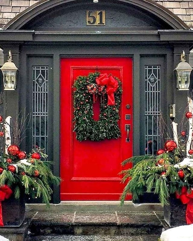 Red Christmas door with a wreath