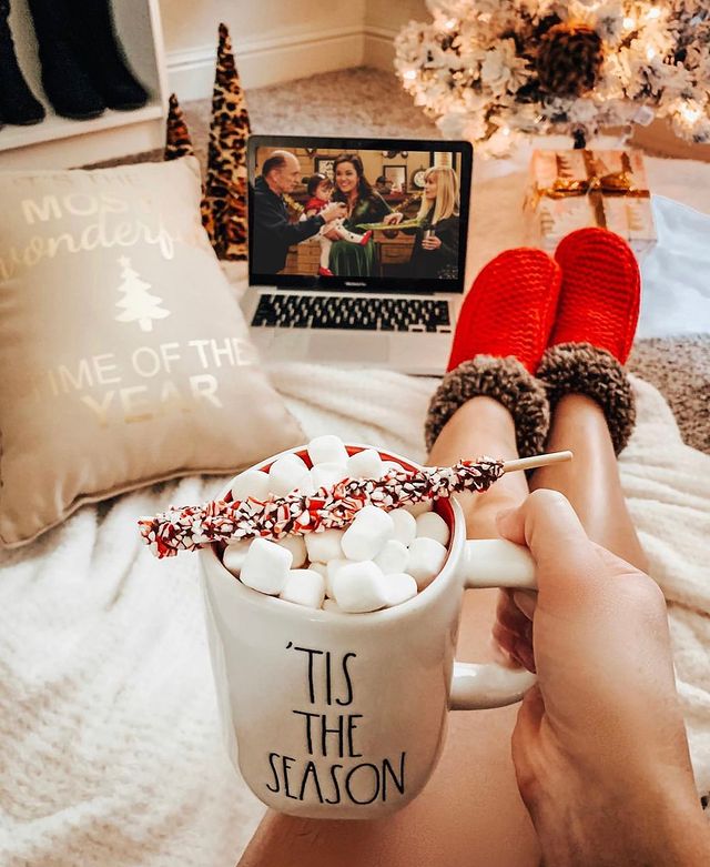 Watching a movie with a Christmas cup