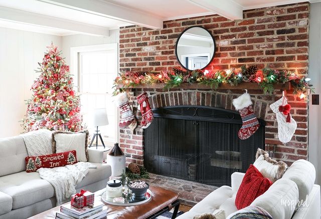 Christmas room with brick fireplace
